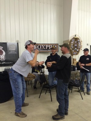 the Dakota Prairie Outdoors team Scott Bachmier and Jesse Flath playing rock-paper-scissors for a Olympic Arms rifle